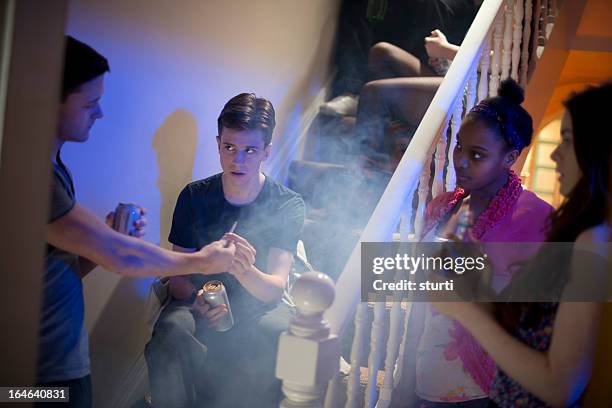 peer pressure at a house party - boy smoking stock pictures, royalty-free photos & images