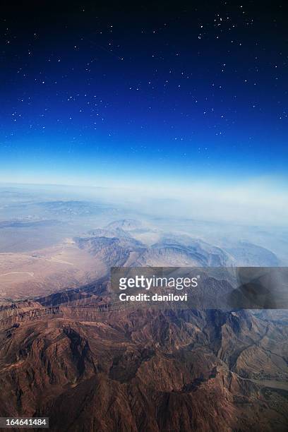 flight above the mountains - earth atmosphere stock pictures, royalty-free photos & images
