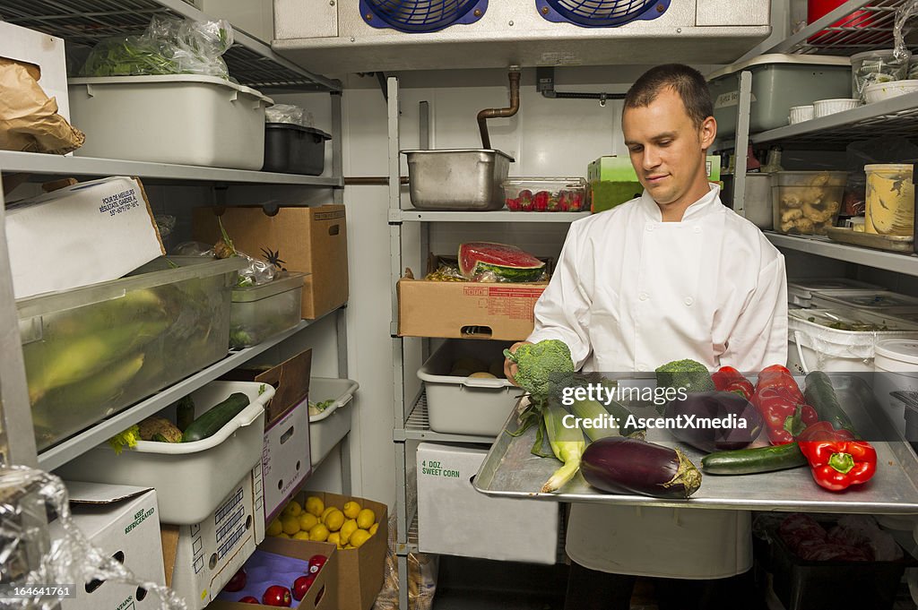 Chef checking his stockroom in preparation for the menu