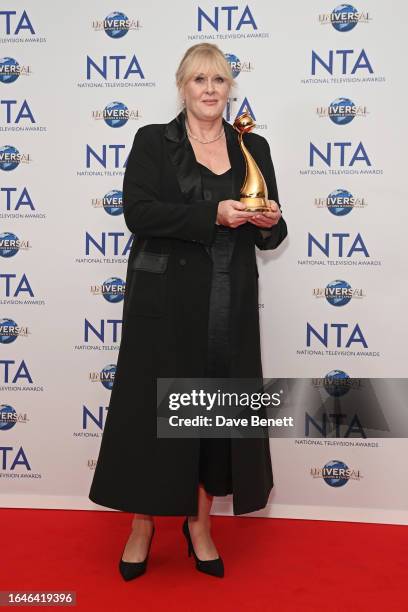 Sarah Lancashire, winner of the Special Recognition award and the Drama Performance award for her work in "Happy Valley", poses in the press room at...