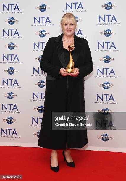 Sarah Lancashire, winner of the Special Recognition award and the Drama Performance award for her work in "Happy Valley", poses in the press room at...
