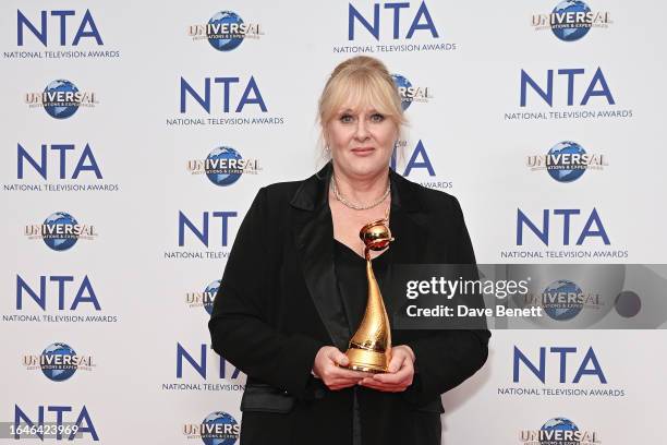 Sarah Lancashire, winner of the Special Recognition award and the Drama Performance award for her work in "Happy Valley", poses in the press room at...