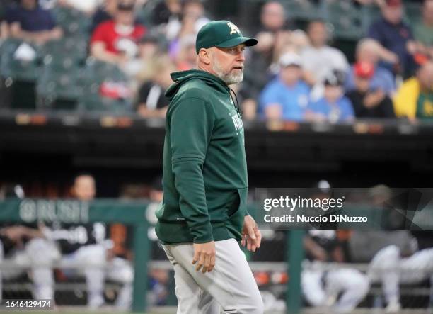 Manager Mark Kotsay of the Oakland Athletics comes out of the dugout to speak with the umpires during the third inning of a game against the Chicago...