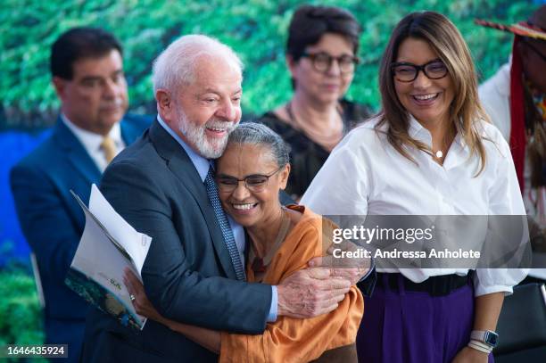 President of Brazil Luiz Inácio Lula da Silva embraces Minister of Environment next to First Lady of Brazil Rosangela Janja da Silva during an event...