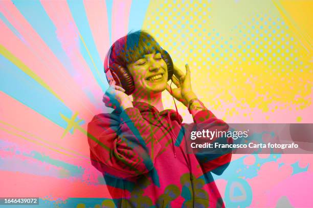 woman listening to music on overlay multicolored design - arte pop fotografías e imágenes de stock