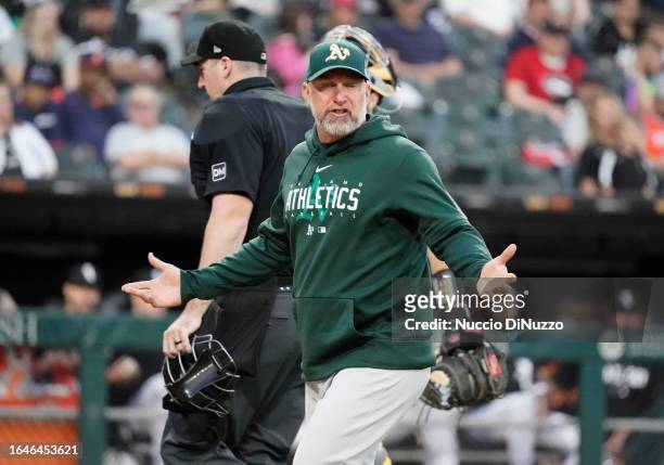 Manager Mark Kotsay of the Oakland Athletics comes out of the dugout to speak with the umpires during the third inning of a game against the Chicago...