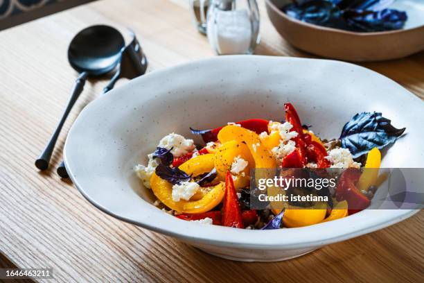 lentil salad with roasted yellow and red bell pepper, cheese and purple basil in rustic bowl, healthy  vegetarian summer food - violetta bell foto e immagini stock