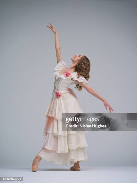ballet dancer in studio dancing wearing beautiful dress - performing arts center stock pictures, royalty-free photos & images