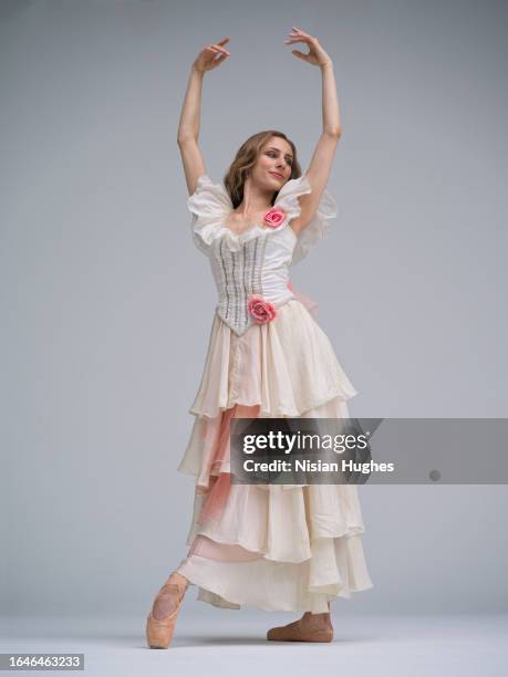 ballet dancer in studio dancing wearing beautiful dress - performing arts center stock pictures, royalty-free photos & images