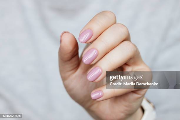 hand with beautiful manicure - pink gel nails - woman manicure stock pictures, royalty-free photos & images