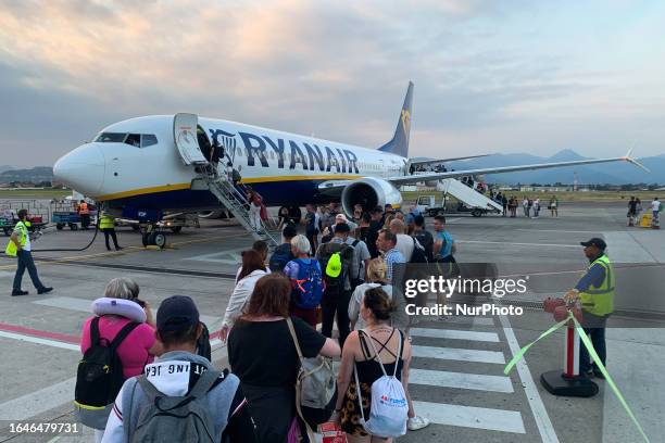 People board Ryanair plane at the airport in Bergamo, Italy on September 4, 2023.