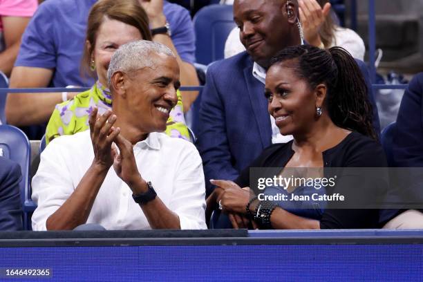 Former President of the United States Barack Obama and former First Lady Michelle Obama attend the men's singles first round match between Novak...