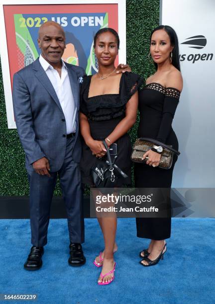 Mike Tyson, Milan Tyson and Kiki Tyson attend the opening night on day one of the 2023 US Open at Arthur Ashe Stadium at the USTA Billie Jean King...