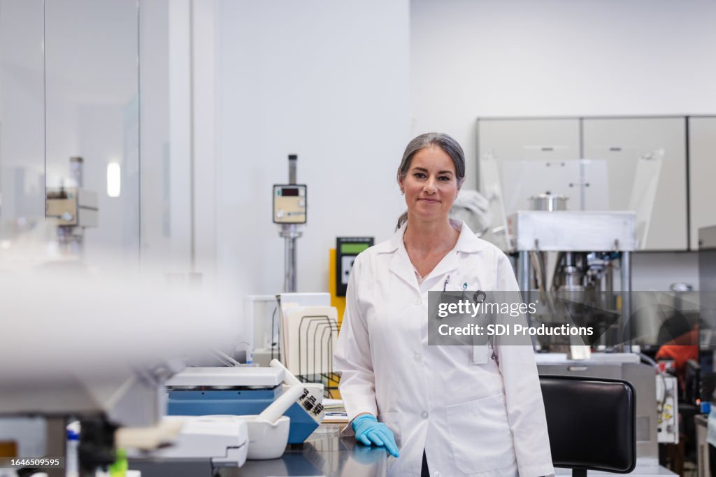 Top female scientist poses for photo in lab