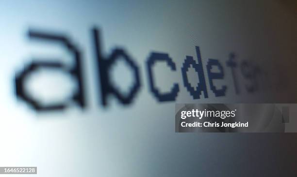 lowercase latin alphabet in futuristic font on computer screen - ordre alphabétique photos et images de collection