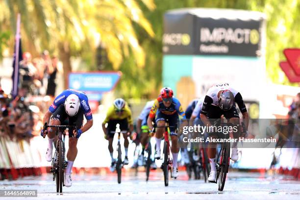 Kaden Groves of Australia and Team Alpecin-Deceuninck and Juan Sebastian Molano Benavides of Colombia and UAE Team Emirates sprint at finish line to...