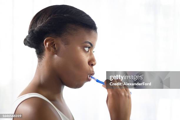 black woman, toothbrush and brushing teeth in morning for dental wellness, healthy habit and gums on mockup space. face of female person cleaning mouth for fresh breath, oral hygiene and care at home - zest ford stock pictures, royalty-free photos & images