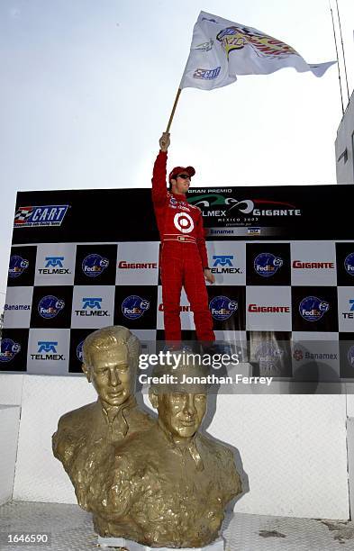 Above the statue of the Mexican driving legends Pedro and Riccardo Rodrigues Bruno Junqueira celebrates pole position after qualifying at the Gran...