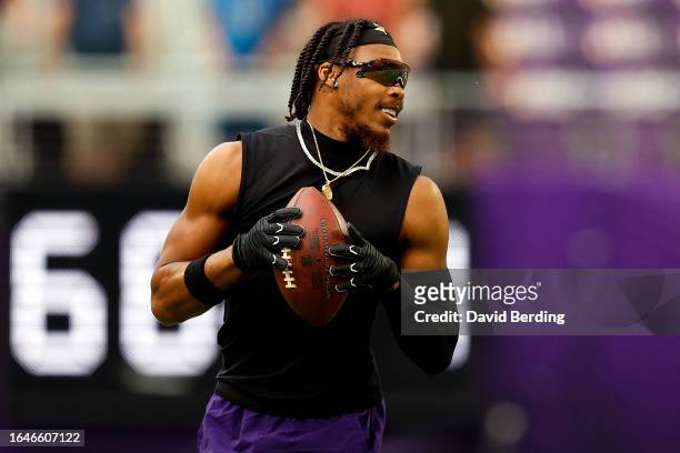 Justin Jefferson of the Minnesota Vikings warms up prior to the start of a preseason game against the Arizona Cardinals at U.S. Bank Stadium on...