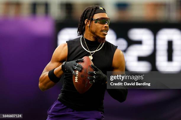 Justin Jefferson of the Minnesota Vikings warms up prior to the start of a preseason game against the Arizona Cardinals at U.S. Bank Stadium on...