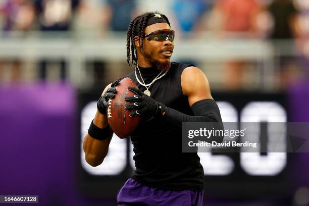 Justin Jefferson of the Minnesota Vikings warms up prior to the start of a preseason game against the Arizona Cardinals at U.S. Bank Stadium on...