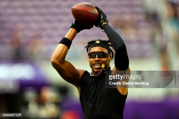 Justin Jefferson of the Minnesota Vikings warms up prior to the start of a preseason game against the Arizona Cardinals at U.S. Bank Stadium on...