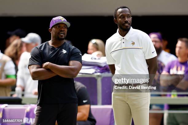 Defensive coordinator Brian Flores talks to general manager Kwesi Adofo-Mensah of the Minnesota Vikings prior to the start of a preseason game...