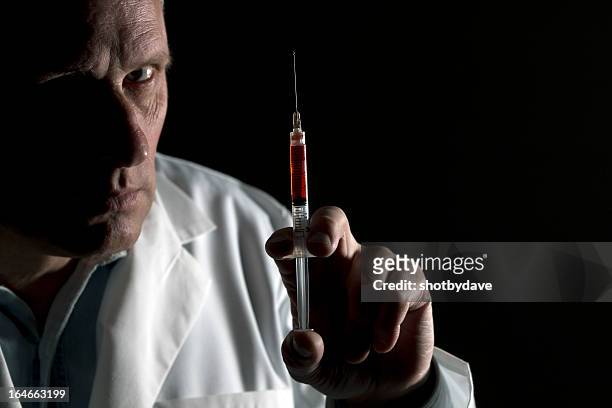 bad medicine - evil doctor stock pictures, royalty-free photos & images