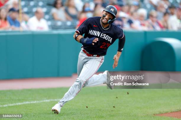 Royce Lewis of the Minnesota Twins runs to score on a double by Max Kepler during the first inning against the Cleveland Guardians at Progressive...