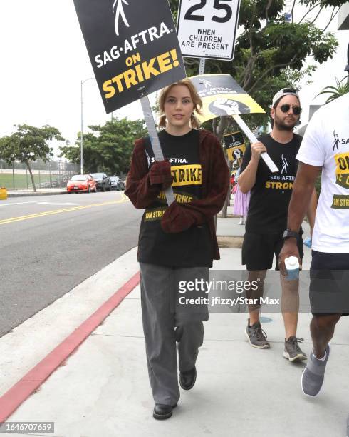 Grace Van Dien walks the picket line in support of the SAG-AFTRA and WGA strike outside of Netflix Studios on September 5, 2023 in Hollywood,...