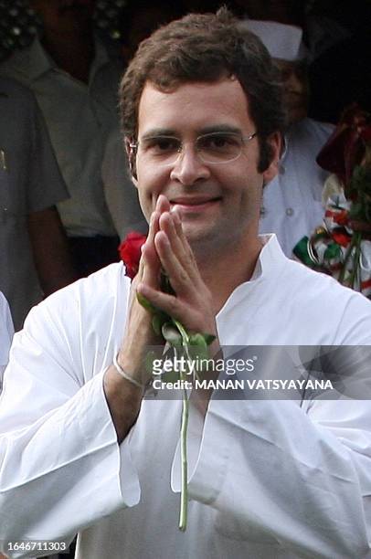 Newly appointed General Secretary of The All India Congress Committee Rahul Gandhi and son of Congress Party President Sonia Gandhi greets supporters...