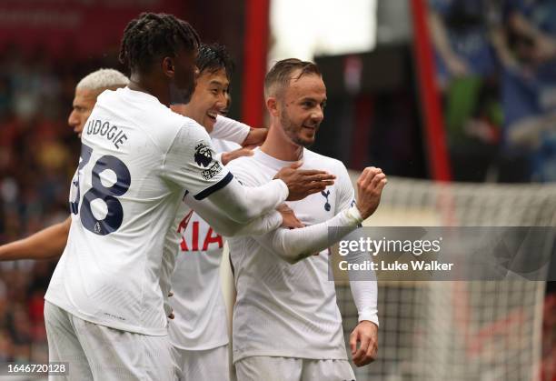 James Maddison of Tottenham Hotspur celebrates with Heung-Min Son and Pape Matar Sarr of Tottenham Hotspur after scoring the team's first goal during...