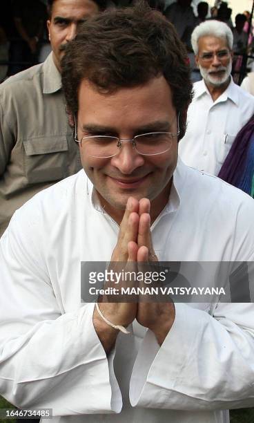 Newly appointed General Secretary of The All India Congress Committee Rahul Gandhi and son of Congress Party President Sonia Gandhi gestures to...
