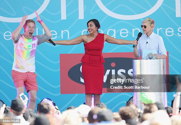 Television personality Ellen DeGeneres appears on stage with Australian singer Jessica Mauboy and a guest from the audience during the filming of her...