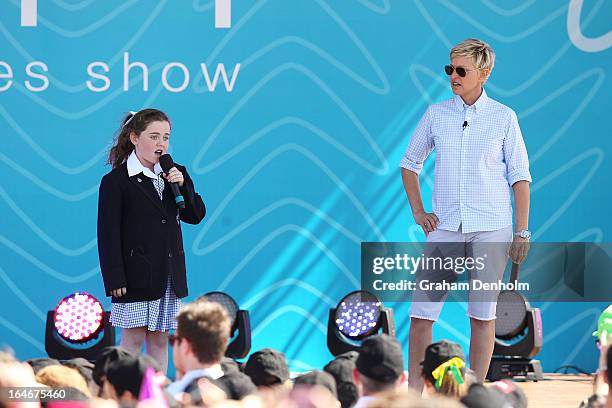 Television personality Ellen DeGeneres appears on stage as schoolgirl Georgia Perry sings during the filming of DeGeneres' television show at...