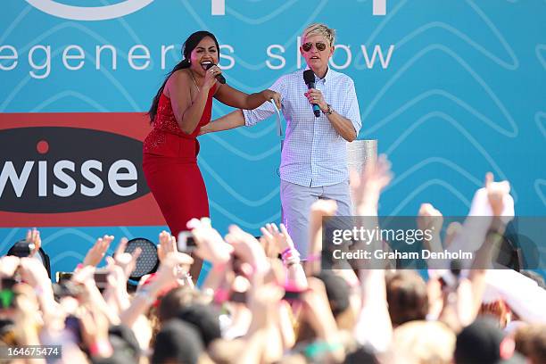 Television personality Ellen DeGeneres and Jessica Mauboy appear on stage during the filming of her television show at Birrarung Marr on March 26,...