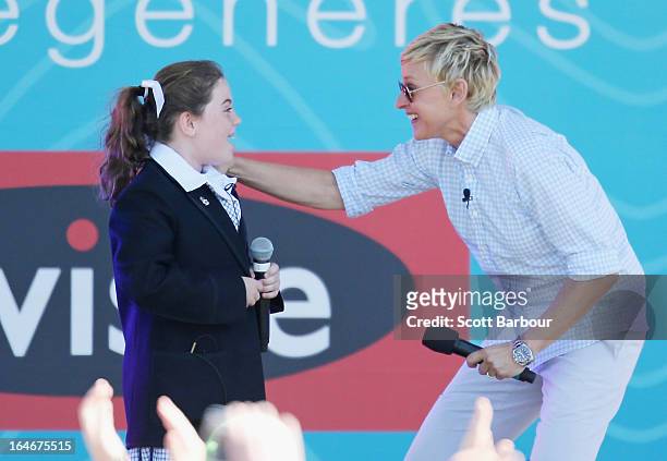 Television personality Ellen DeGeneres appears on stage with schoolgirl Georgia who sung for her during the filming of her television show at...