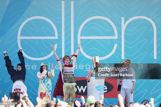 Television personality Ellen DeGeneres appears on stage with members of the audience who had dressed up for the occasion during the filming of her...