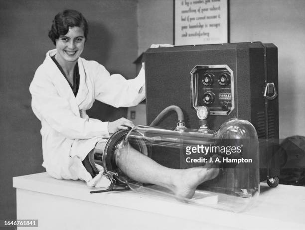 Woman demonstrates a 'Pavsex' for restoring circulation to legs at the International Medical Exhibition, Royal Horticultural Hall, Westminster,...