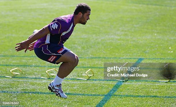 Kenneath Bromwich jumps during a Melbourne Storm training session at Gosch's Paddock on March 26, 2013 in Melbourne, Australia.