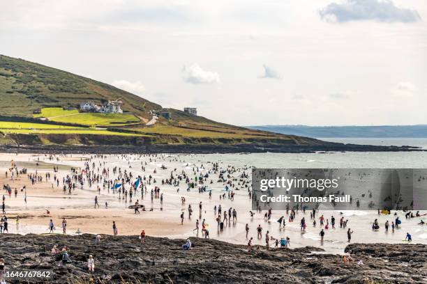 thousands of people on croyde beach in devon - croyde beach stock pictures, royalty-free photos & images