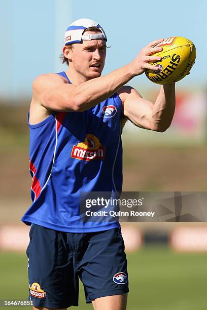 Tom Williams of the Bulldogs marks during a Western Bulldogs AFL training session at Whitten Oval on March 26, 2013 in Melbourne, Australia.