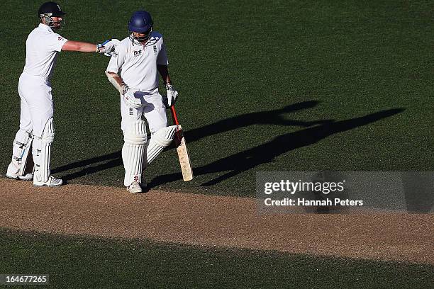 Monty Panesar and Matt Prior of England celebrate drawing the Third Test match between New Zealand and England at Eden Park on March 26, 2013 in...