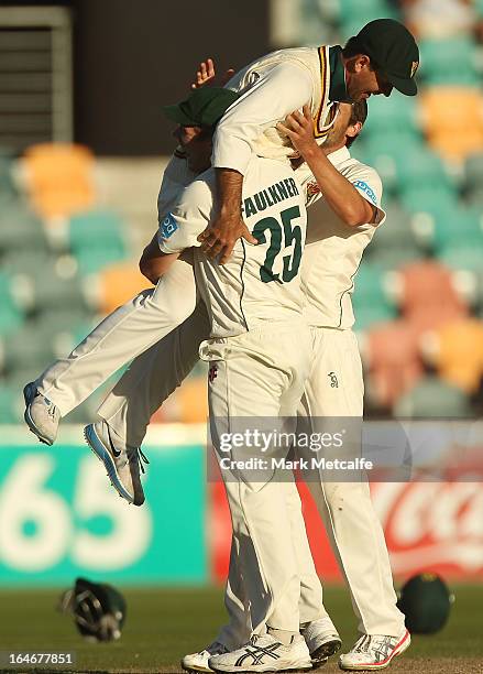 Ricky Ponting of the Tigers is picked up by teammates James Faulkner and Ben Hilfenhaus in celebration of victory in the Sheffield Shield final...