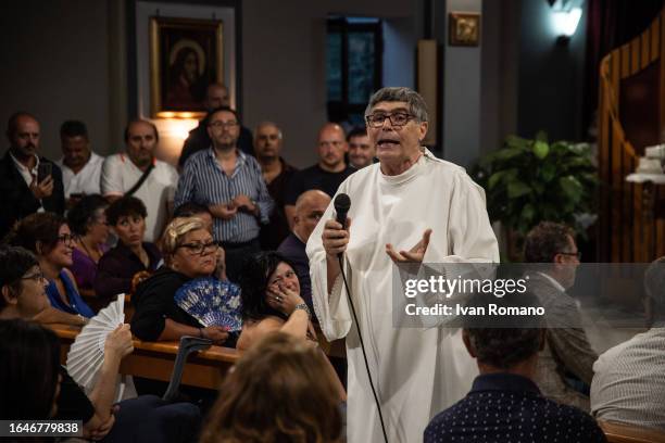 Don Maurizio Patriciello parish priest in the church of San Paolo Apostolo in the Green Park on August 29, 2023 in Naples, Italy. Two children of...