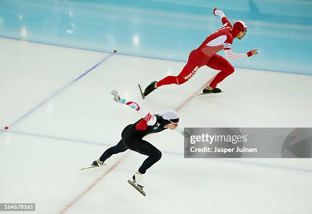 Tucker Fredricks of the US competes against Artur Was of Poland during the 500m race on day four of the Essent ISU World Single Distances Speed...