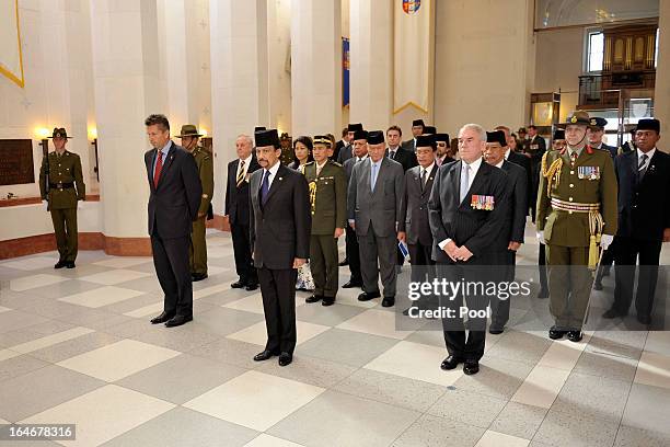 Sultan of Brunei Darussalam, His Majesty Hassanal Bolkiah and MP Chris Tremain look on during a wreath-laying ceremony at the National War Memorial...