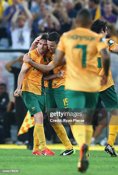 Brett Holman of the Socceroos celebrates after scoring his team's second goal during the FIFA 2014 World Cup Qualifier match between the Australian...