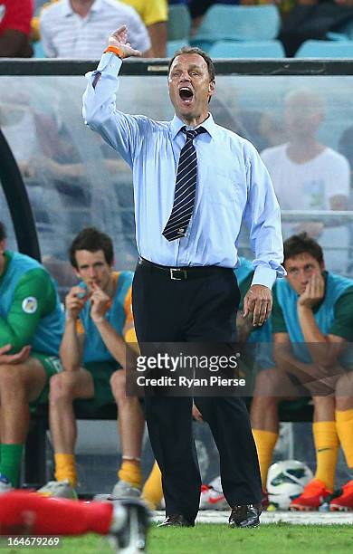 Holger Osieck, coach of the Socceroos, instructs his players during the FIFA 2014 World Cup Qualifier match between the Australian Socceroos and Oman...