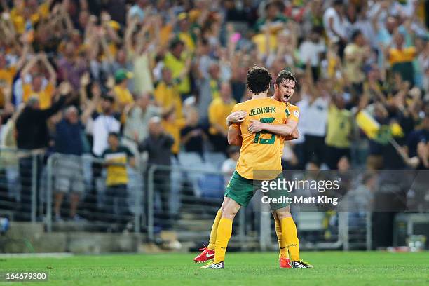 Brett Homan of the Socceroos celebrates with Mile Jedinak after scoring a goal during the FIFA 2014 World Cup Qualifier match between the Australian...